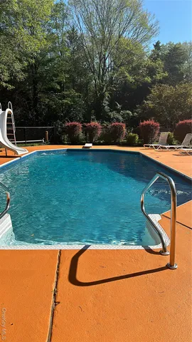 swimming pool with trees in the background