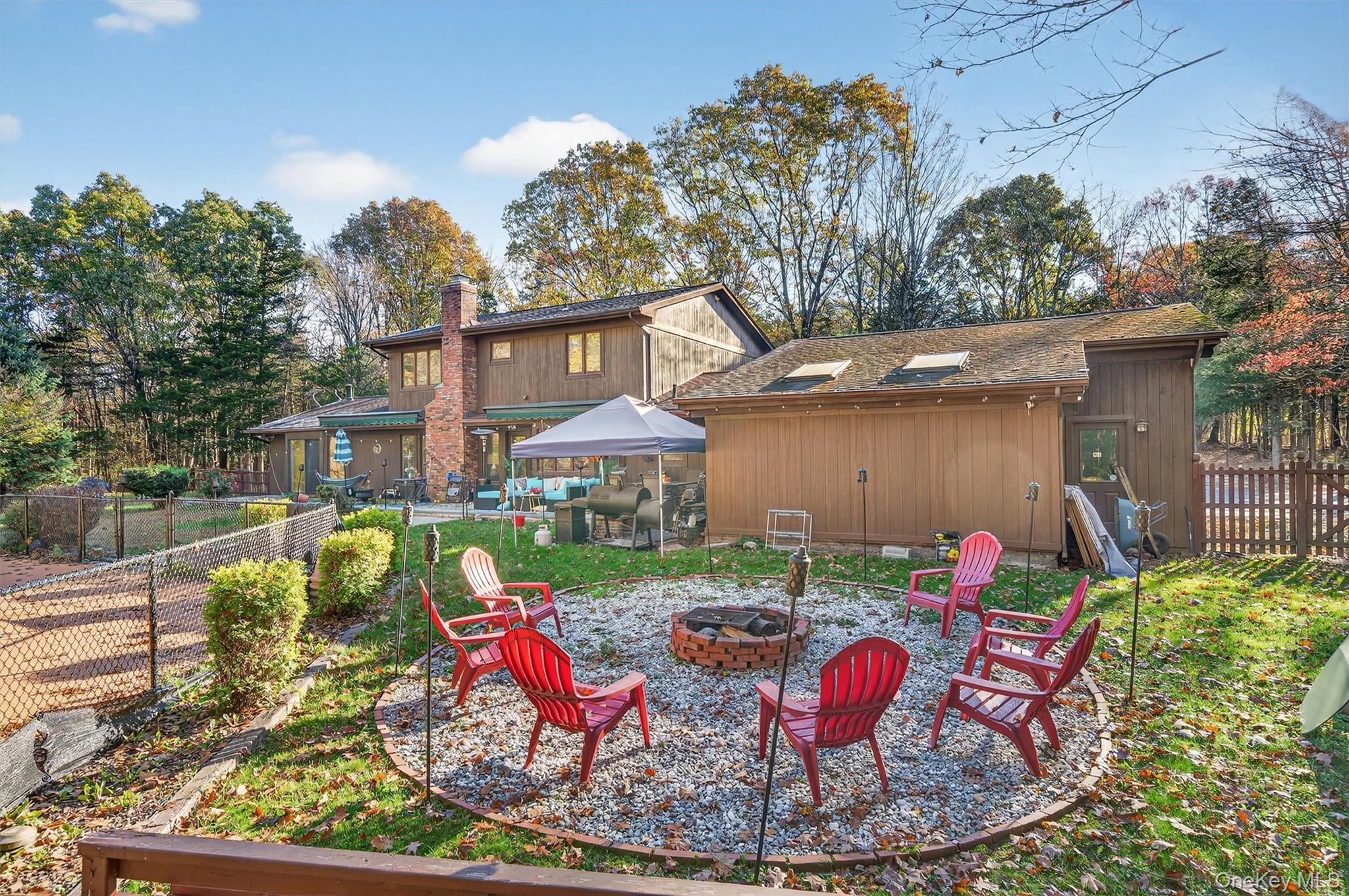 7 Park Place Chester, NY 10918 - Photo 46 of 48 a view of a house with a yard patio and fire pit