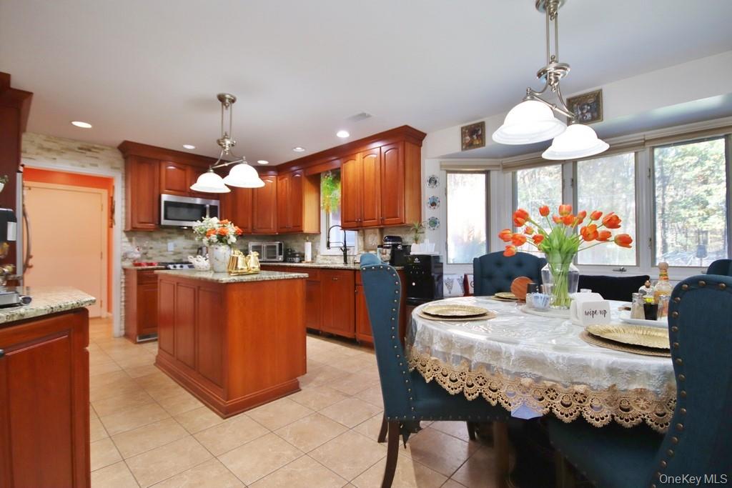 7 Park Place Chester, NY 10918 - Photo 8 of 48 a dining room filled chandelier and kitchen view