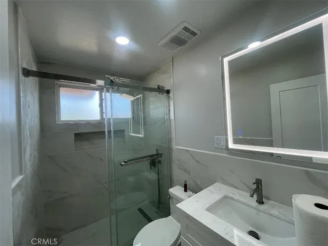 a bathroom with a sink and a toilet