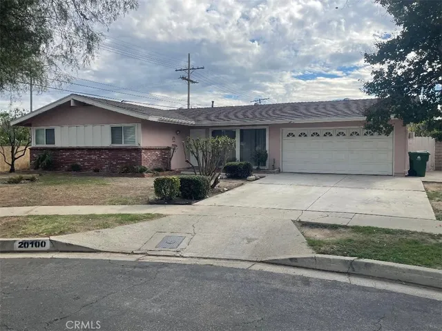 a view of a porch with furniture and a tree