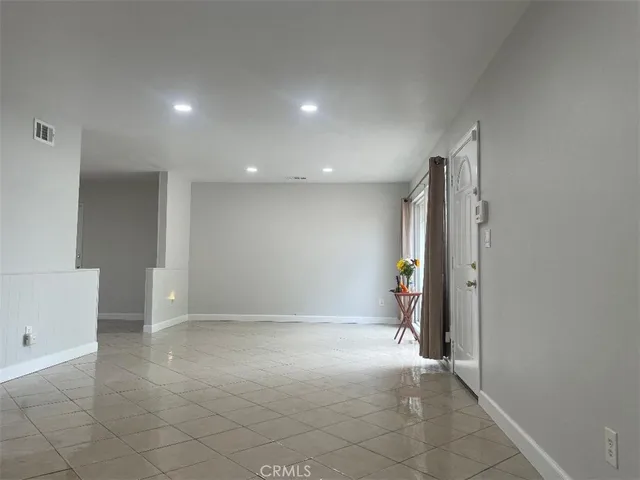 a kitchen with granite countertop a stove and a sink