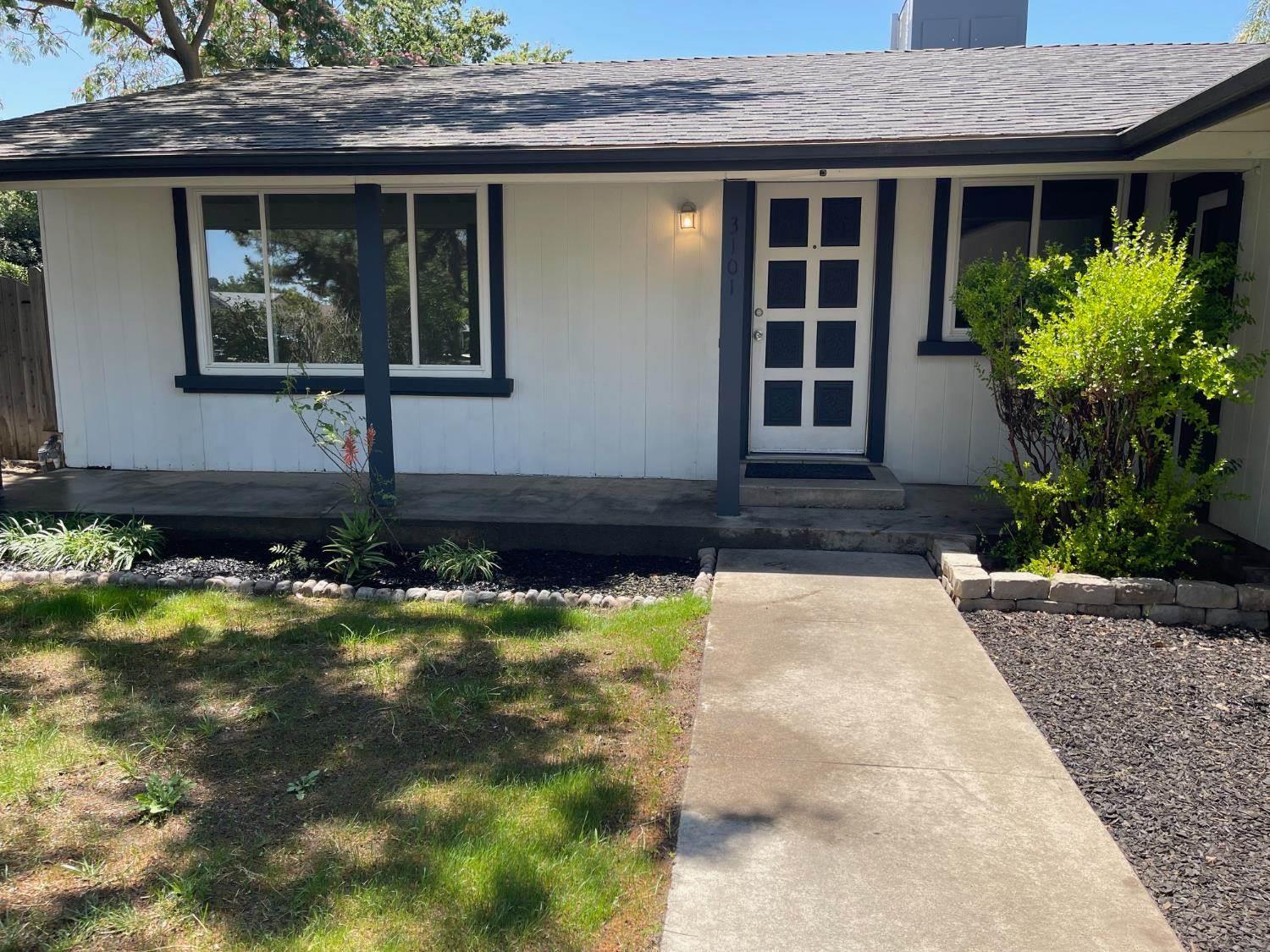 3101 Wyatt Way Modesto, CA 95350 - Photo 1 of 17 a front view of a house with garden