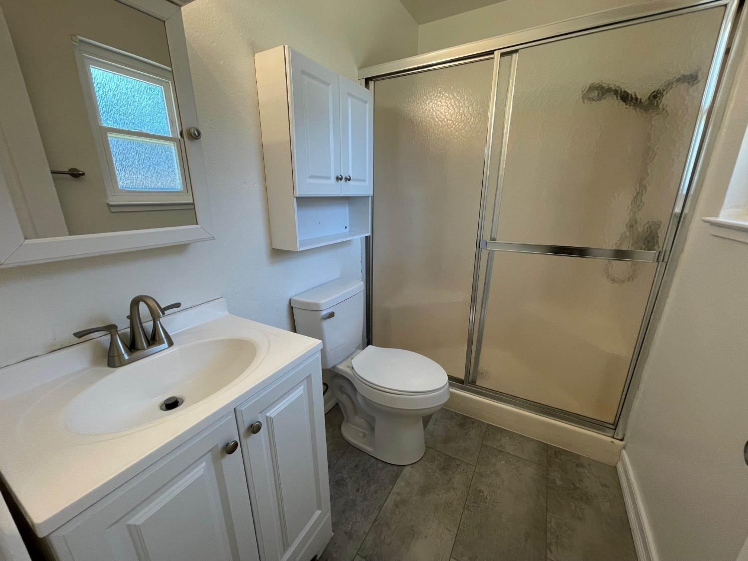 3101 Wyatt Way Modesto, CA 95350 - Photo 15 of 17 a bathroom with a sink toilet and shower