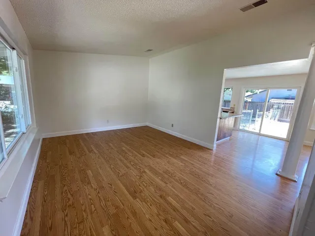 wooden floor in a hall with an entryway