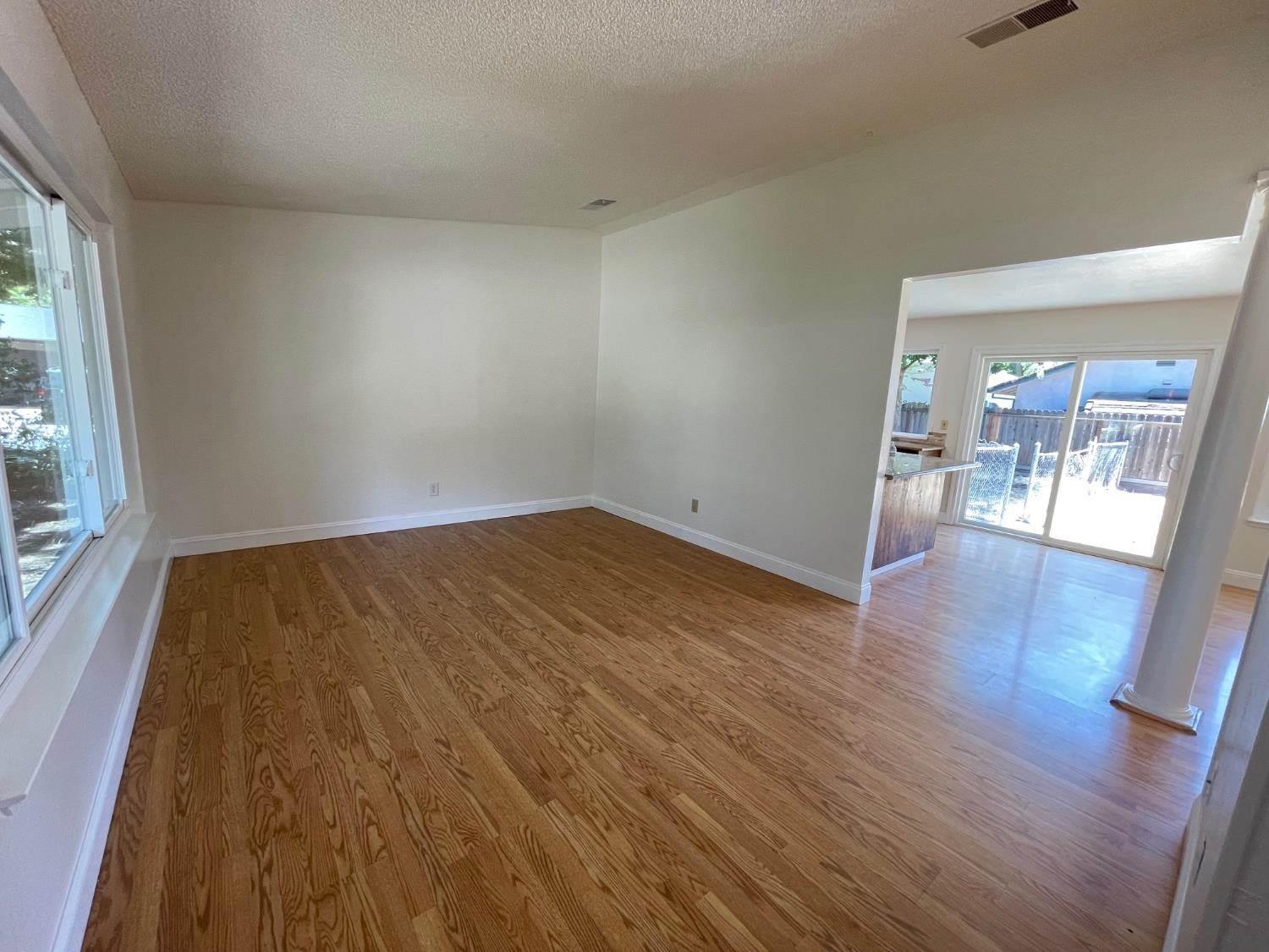 3101 Wyatt Way Modesto, CA 95350 - Photo 6 of 17 wooden floor in a hall with an entryway