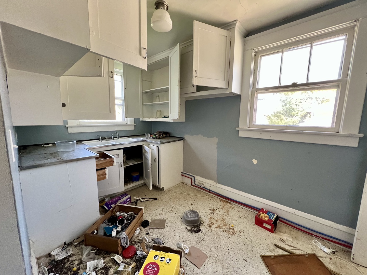 233 North Edward Street Decatur, IL 62522 - Photo 17 of 31 a room with furniture a flat screen tv and a window