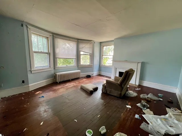 a bedroom with furniture and a window