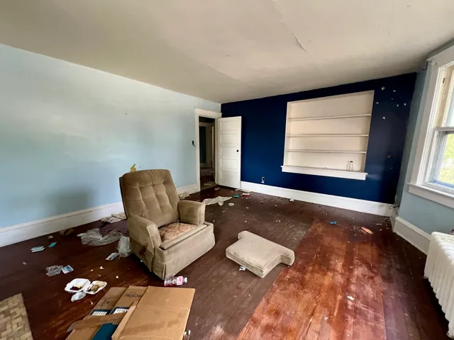 a living room with furniture and a rug