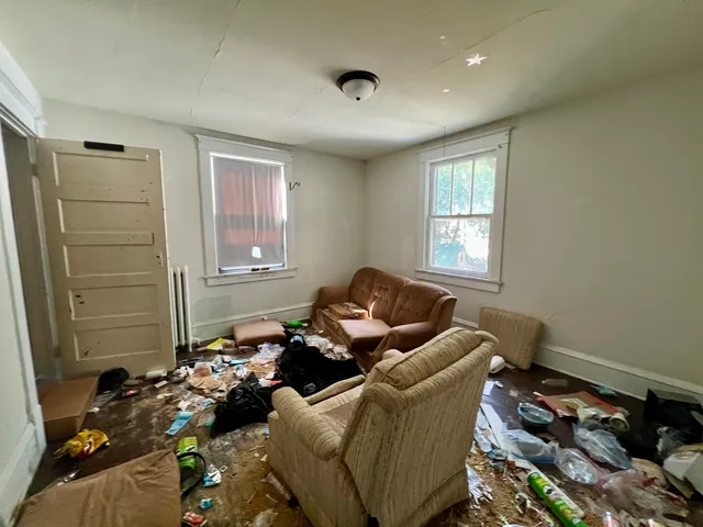 a living room with furniture and a window