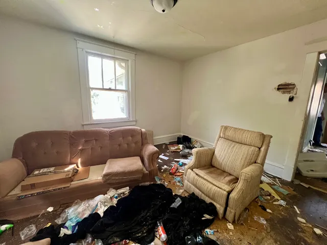 a living room with furniture and a window