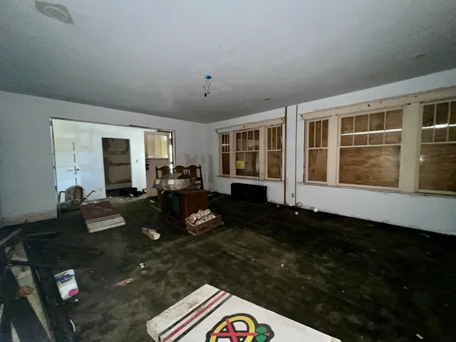 a living room with furniture rug and wooden floor