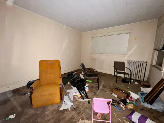 a room with furniture and wooden floor