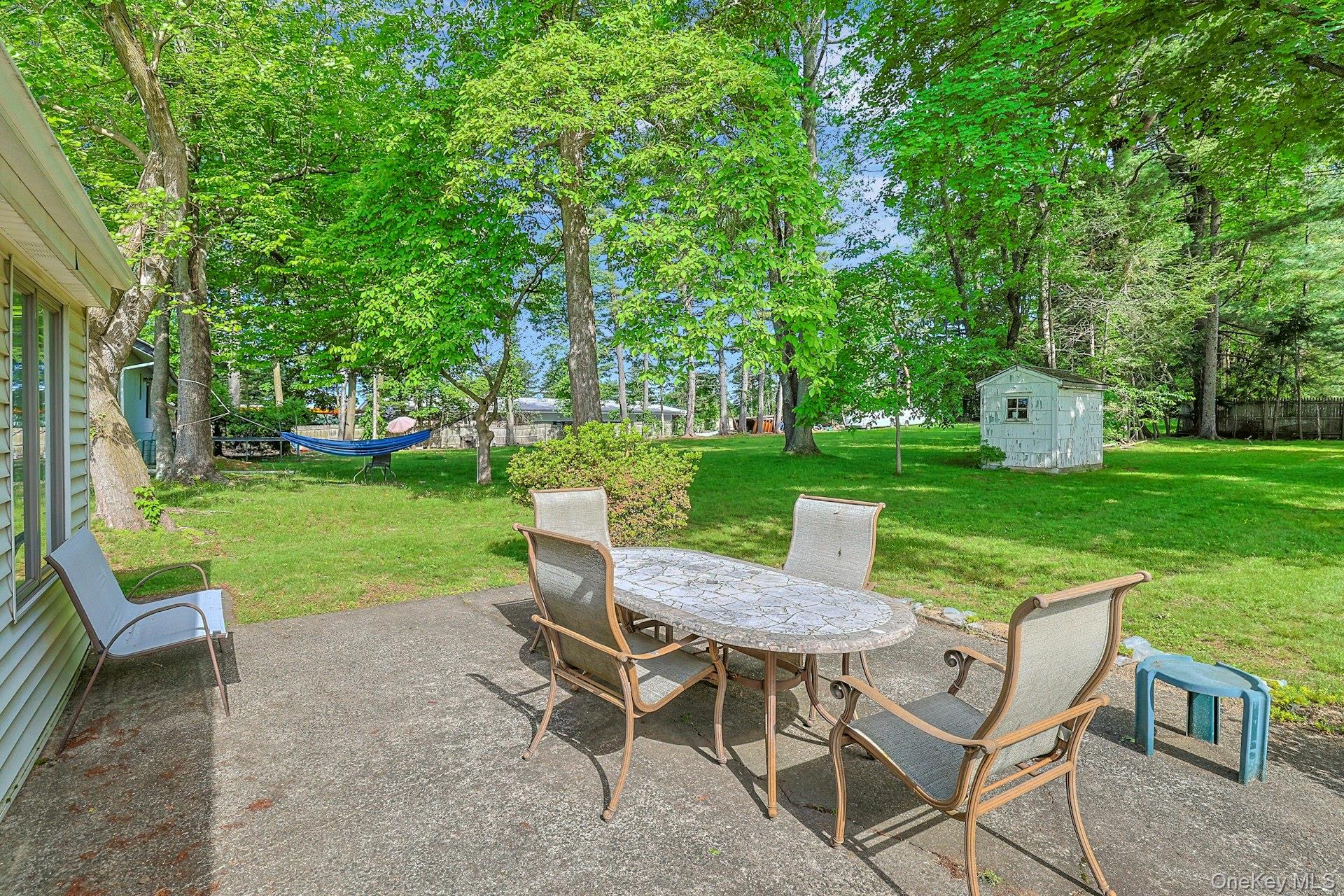 31 Townline Road Pearl River, NY 10965 - Photo 22 of 27 a view of a table and chairs in the garden
