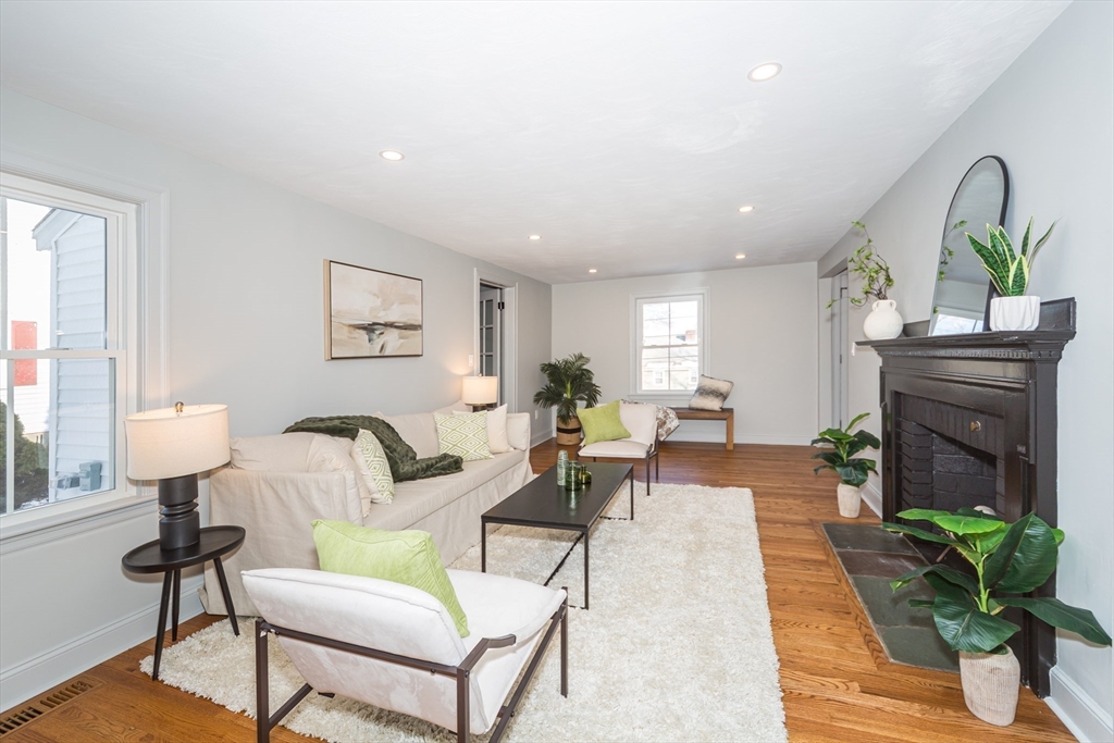 12 Bay State Road Natick, MA 01760 - Photo 15 of 35 a living room with furniture flowerpot and a fireplace