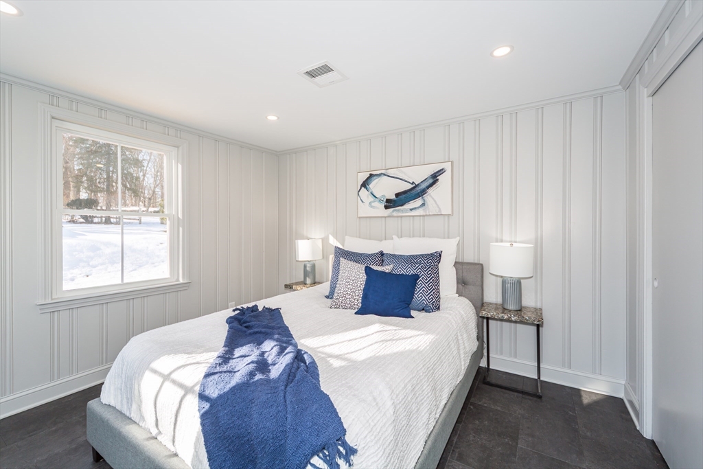 12 Bay State Road Natick, MA 01760 - Photo 16 of 35 a bedroom with a large bed and a window