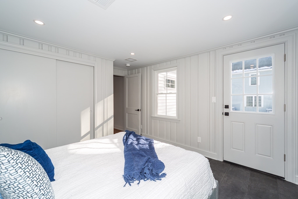 12 Bay State Road Natick, MA 01760 - Photo 17 of 35 a bedroom with a bed and a window