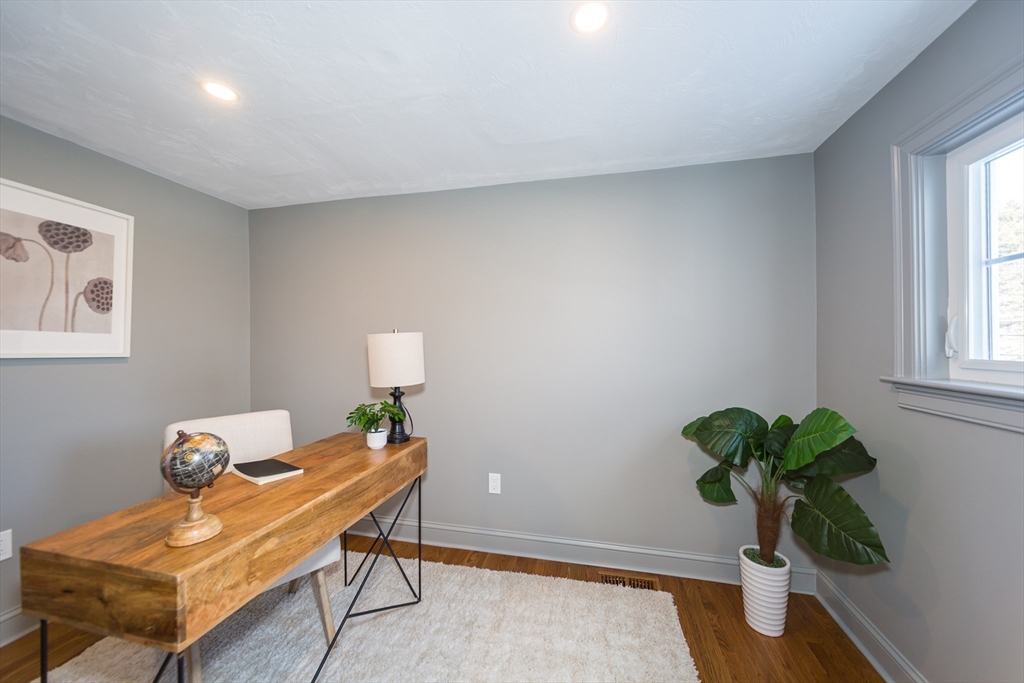 12 Bay State Road Natick, MA 01760 - Photo 18 of 35 a view of a workspace with furniture and a potted plant