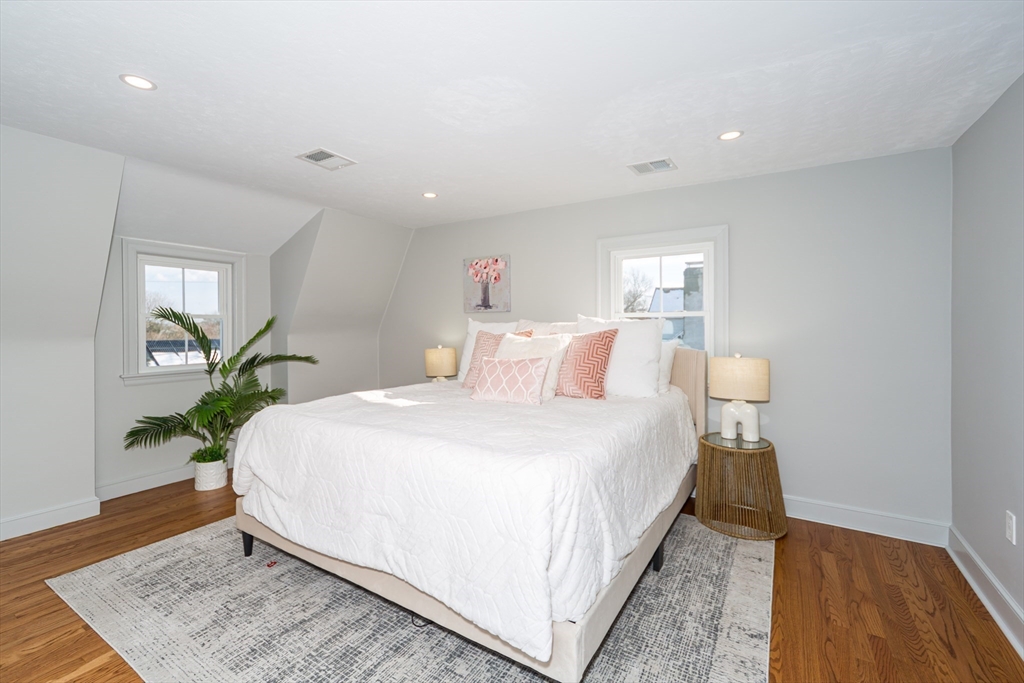 12 Bay State Road Natick, MA 01760 - Photo 19 of 35 a bedroom with bed and a potted plant