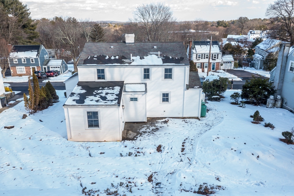 12 Bay State Road Natick, MA 01760 - Photo 31 of 35 a view of a house with a snow in the background