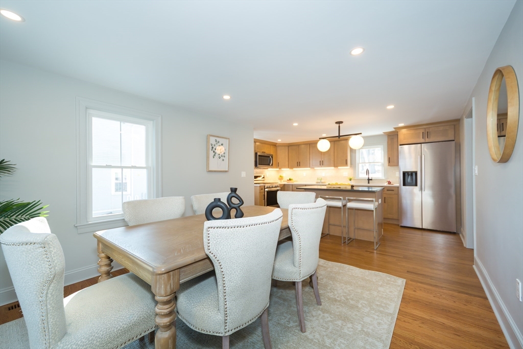 12 Bay State Road Natick, MA 01760 - Photo 8 of 35 a view of a dining room with furniture and wooden floor