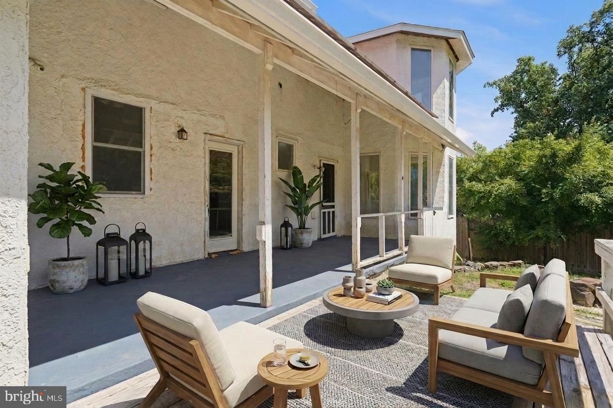 73 Church Road Arnold, MD 21012 - Photo 26 of 29 a outdoor space with patio the couches and a potted plant
