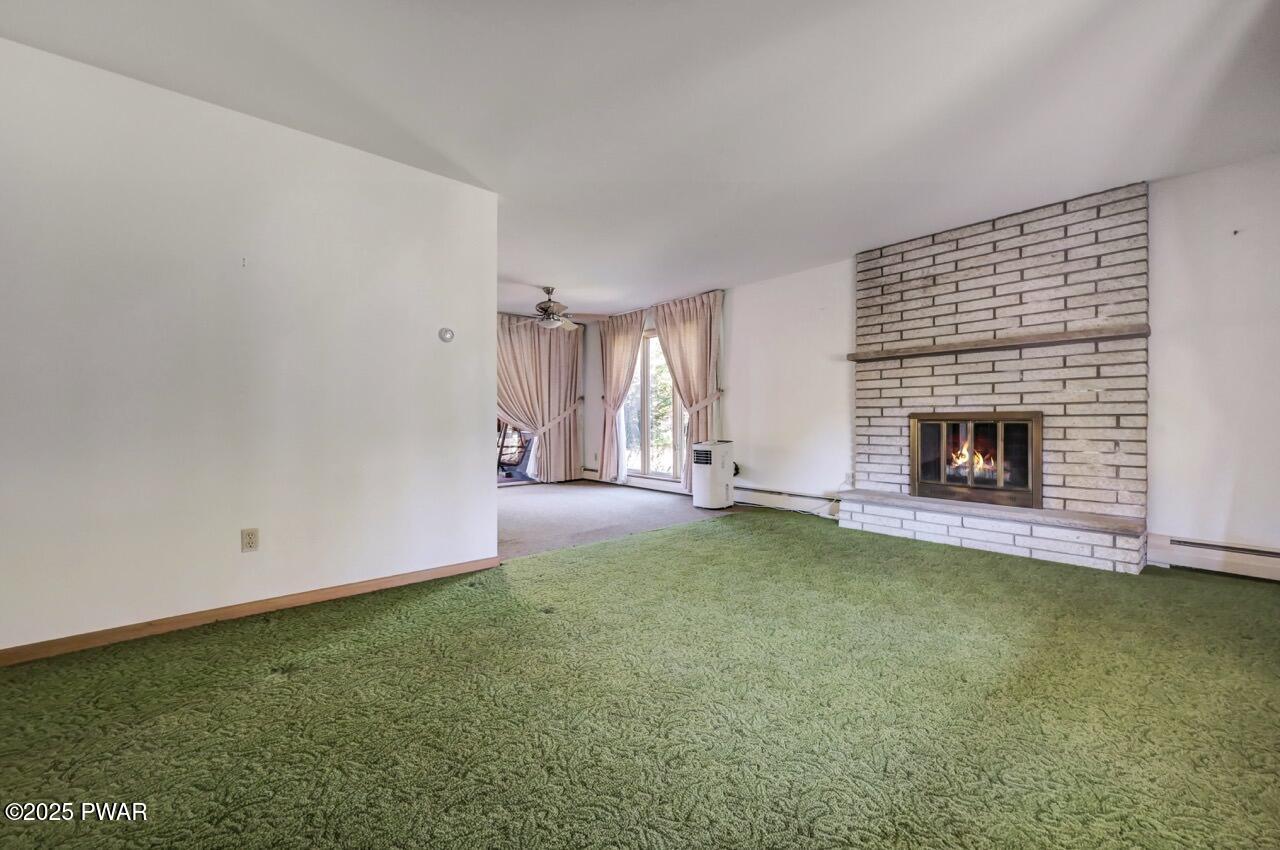 100 Spring Hill Road Moscow, PA 18444 - Photo 15 of 101 a view of an empty room with window and fire place