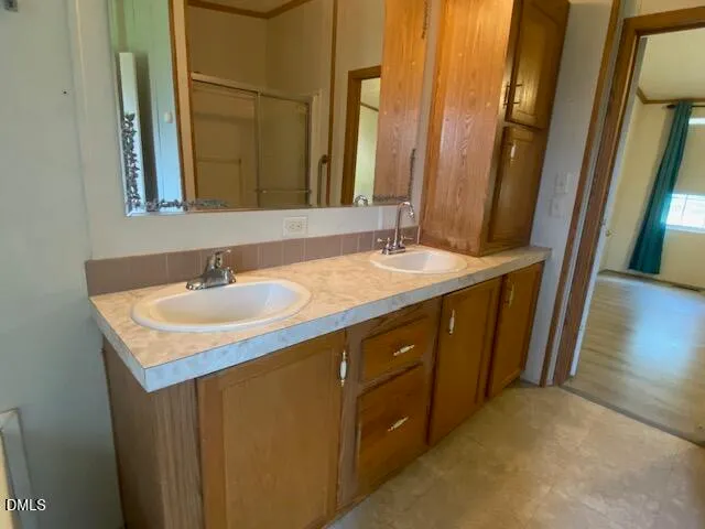 a bathroom with a sink and a mirror
