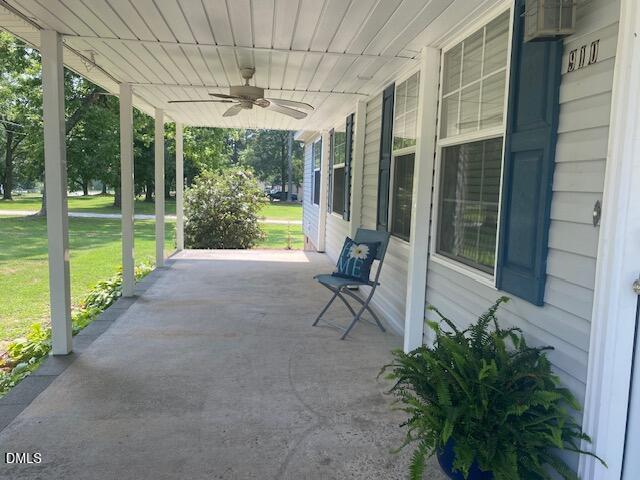910 Vanco Mill Road Henderson, NC 27537 - Photo 2 of 17 a view of a porch with chairs and backyard