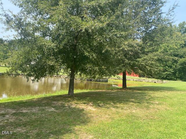 910 Vanco Mill Road Henderson, NC 27537 - Photo 4 of 17 a view of outdoor space with deck and trees