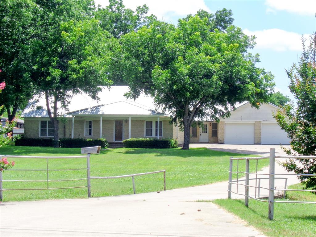 1717 Pipeline Road Cleburne, TX 76033 - Photo 19 of 33 Ranch-style residence featuring a metal roof and light-colored brick exterior