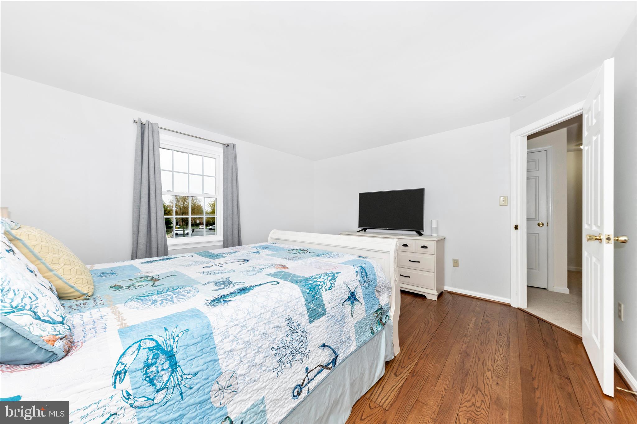 8226 Red Wing Court Frederick, MD 21701 - Photo 17 of 45 a bedroom with a bed and a television