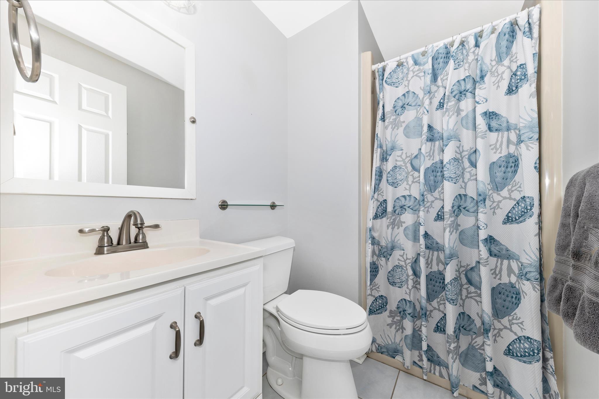 8226 Red Wing Court Frederick, MD 21701 - Photo 19 of 45 a bathroom with a sink toilet and mirror