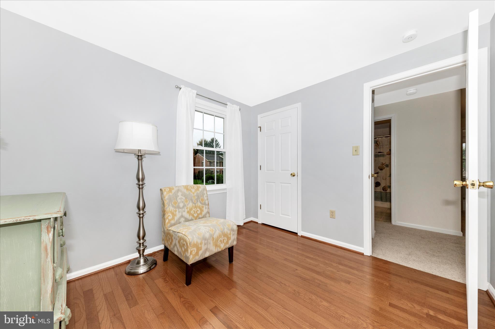 8226 Red Wing Court Frederick, MD 21701 - Photo 21 of 45 wooden floor in an empty room with a window and wooden floor