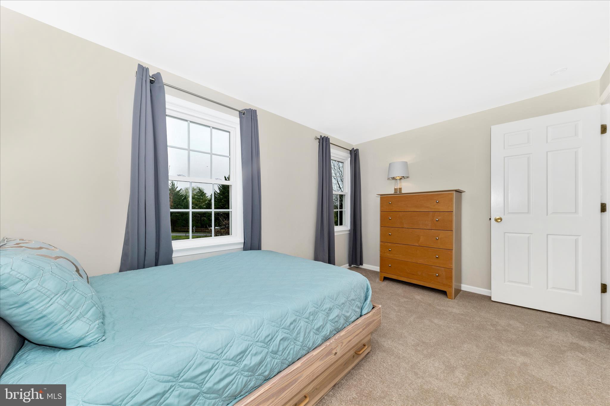 8226 Red Wing Court Frederick, MD 21701 - Photo 25 of 45 a bedroom with a bed and a window