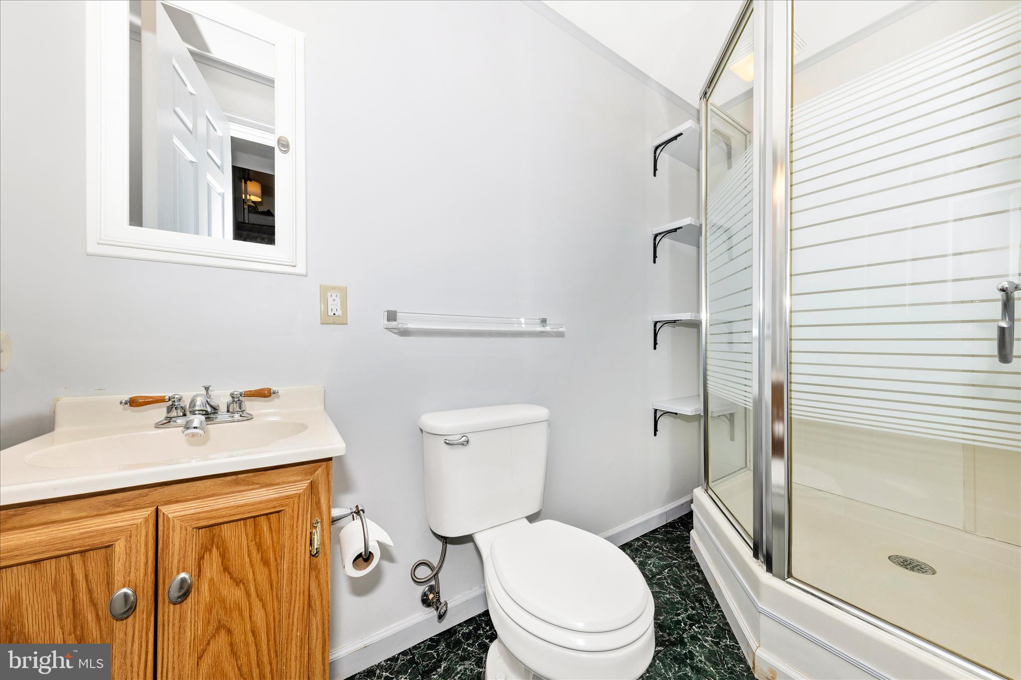 8226 Red Wing Court Frederick, MD 21701 - Photo 33 of 45 a white toilet sitting next to a bathroom sink