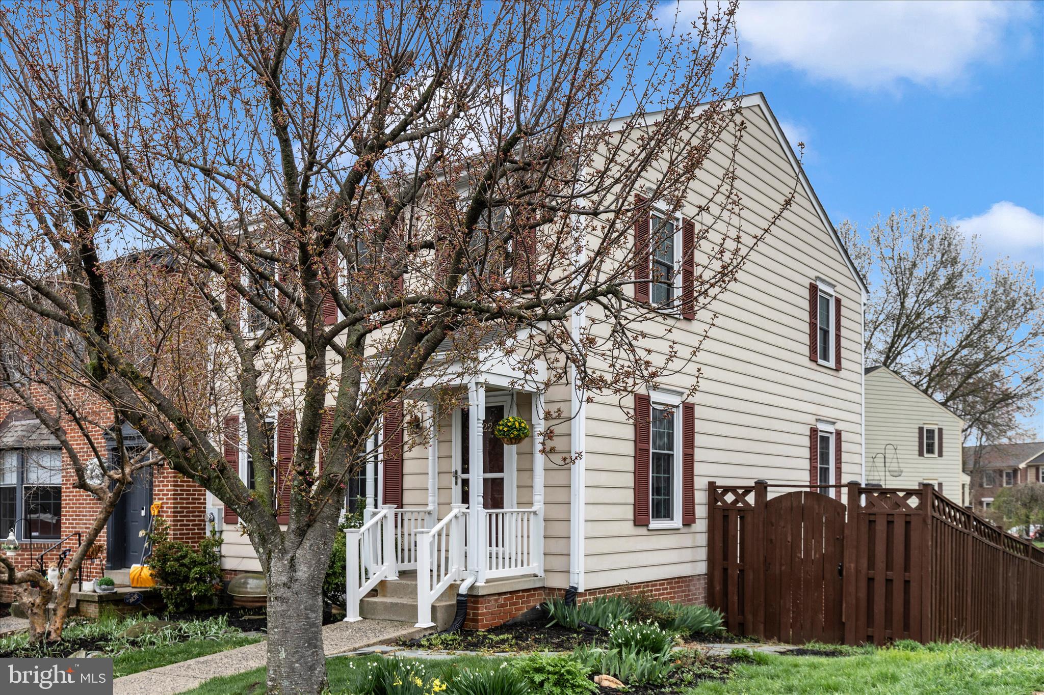 8226 Red Wing Court Frederick, MD 21701 - Photo 35 of 45 a view of a house with a large tree and wooden fence