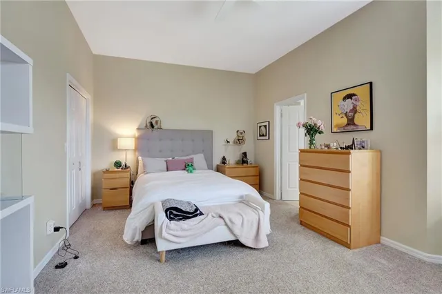 a bedroom with a bed and a cabinets