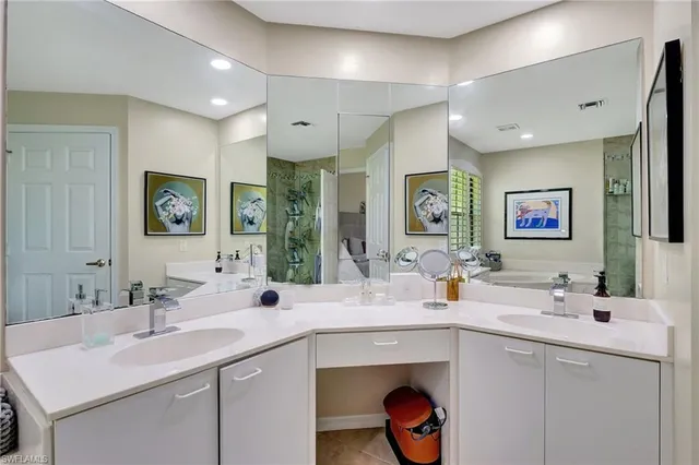 a bathroom with a sink double vanity and a mirror