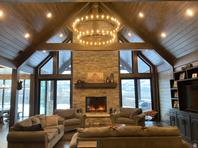 259 Meadow Drive Springville, UT 84663 - Photo 8 of 62 Living room with a fireplace, wood finished floors, a high wood ceiling, and a chandelier