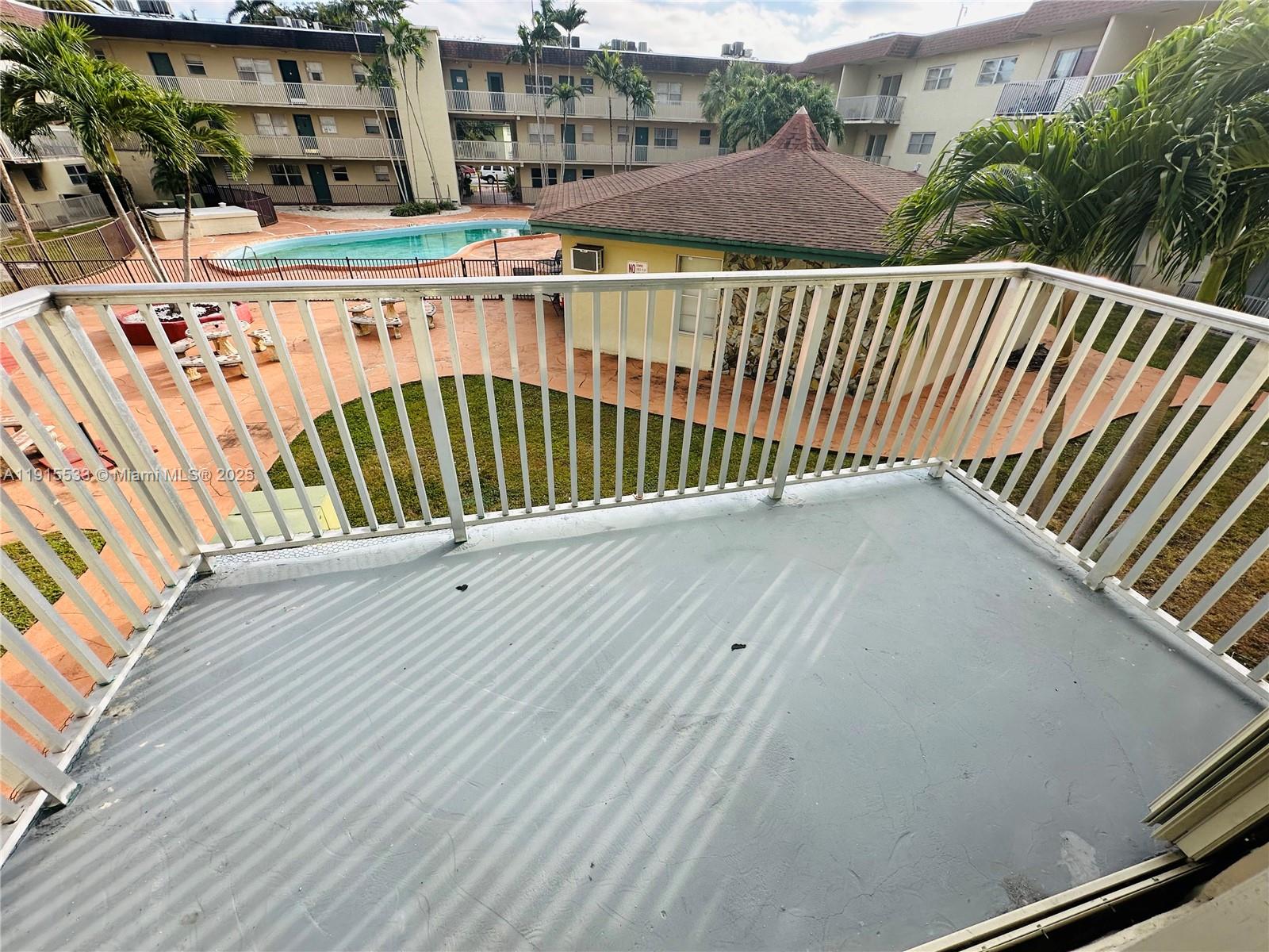 7505 Southwest 82nd Street, Unit 211 Miami, FL 33143 - Photo 15 of 17 a balcony with an outdoor space