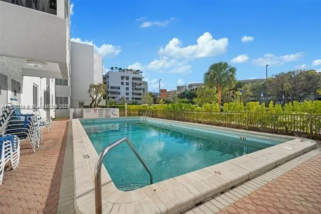 a view of a swimming pool with a patio