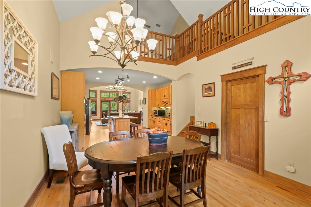 138 South Camp Road, Unit 103 Boone, NC 28607 - Photo 7 of 50 a view of a dining room with furniture and wooden floor