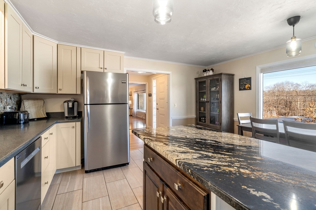 6 Wallace Road Sturbridge, MA 01566 - Photo 11 of 22 a kitchen with refrigerator and cabinets