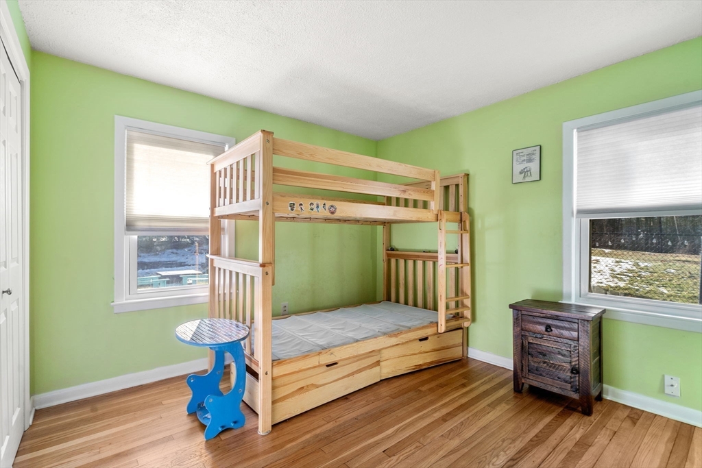 6 Wallace Road Sturbridge, MA 01566 - Photo 16 of 22 a bedroom with a bed and windows