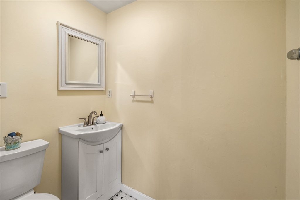 6 Wallace Road Sturbridge, MA 01566 - Photo 19 of 22 a bathroom with a toilet sink and mirror