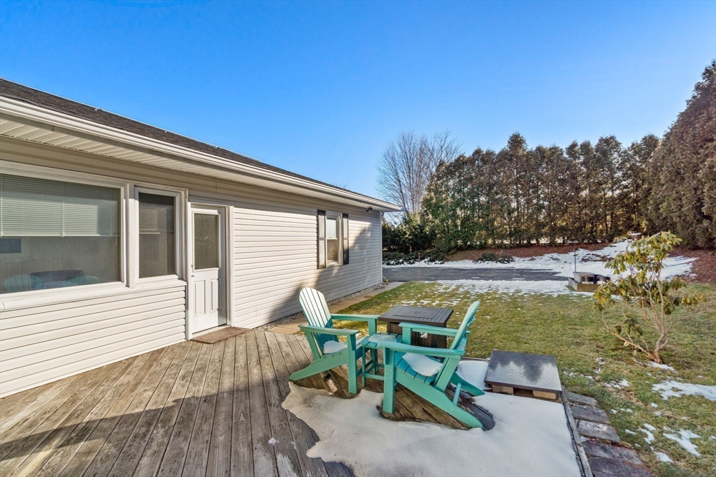 6 Wallace Road Sturbridge, MA 01566 - Photo 21 of 22 a view of backyard with seating space and trees in the background