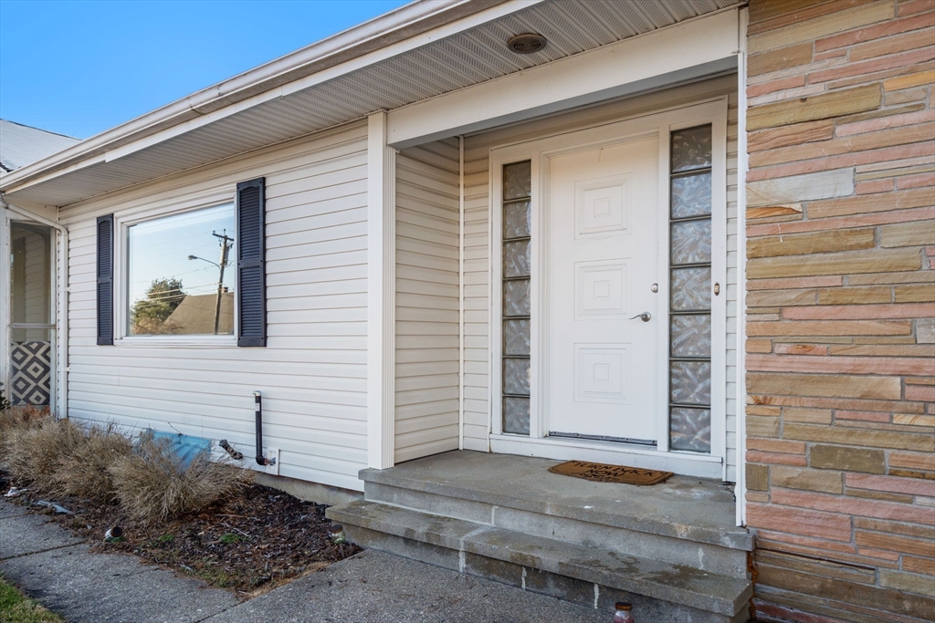 6 Wallace Road Sturbridge, MA 01566 - Photo 3 of 22 a front view of a house with a garage