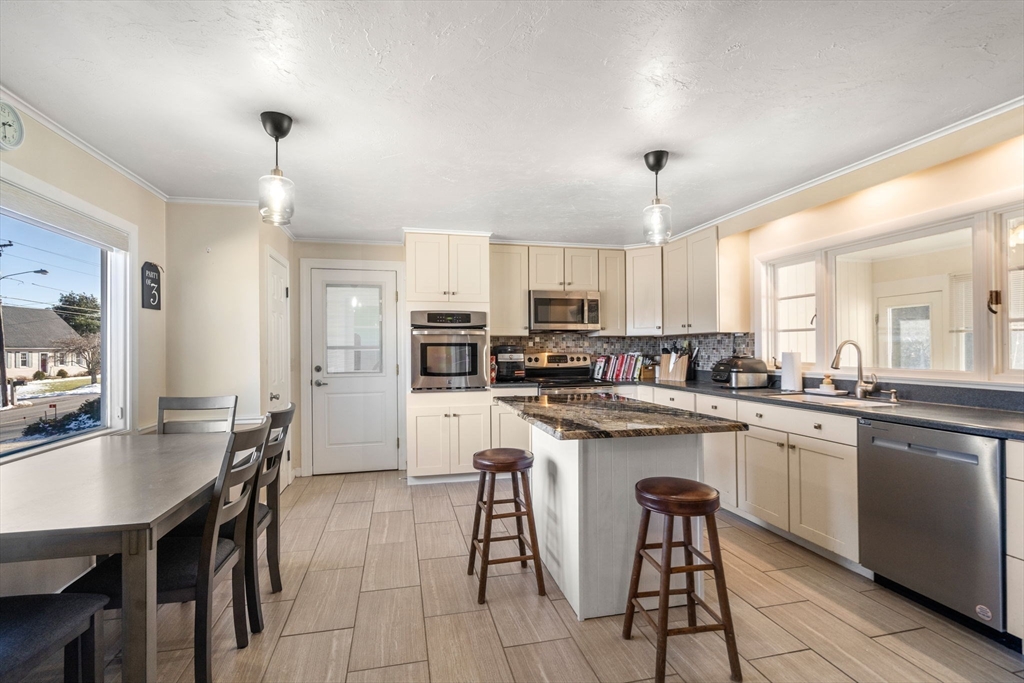 6 Wallace Road Sturbridge, MA 01566 - Photo 9 of 22 a kitchen with appliances a sink a counter top space and cabinets