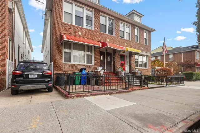 a view of a brick building with a bench in front of building